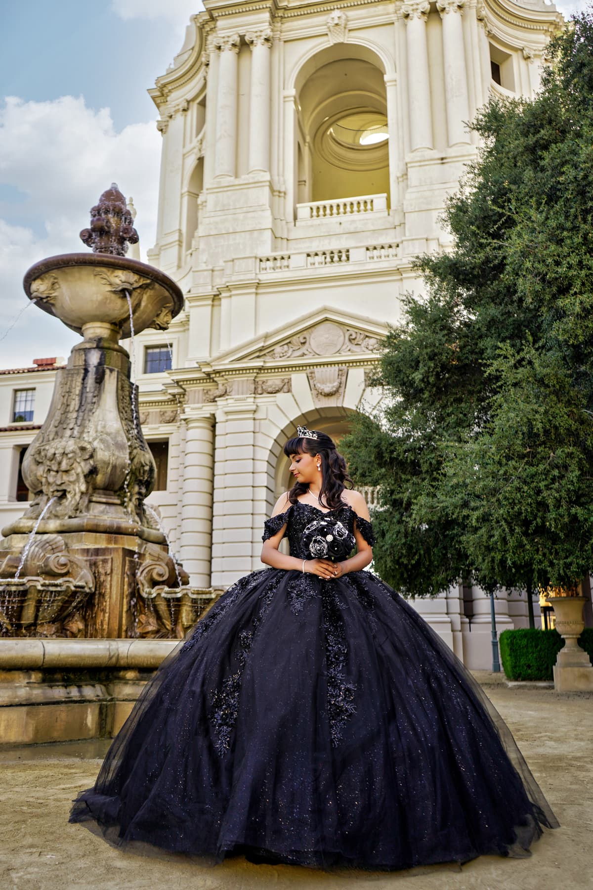 Quincea\u00f1era photo booth with flower wall at Airtel Plaza Hotel in Van Nuys