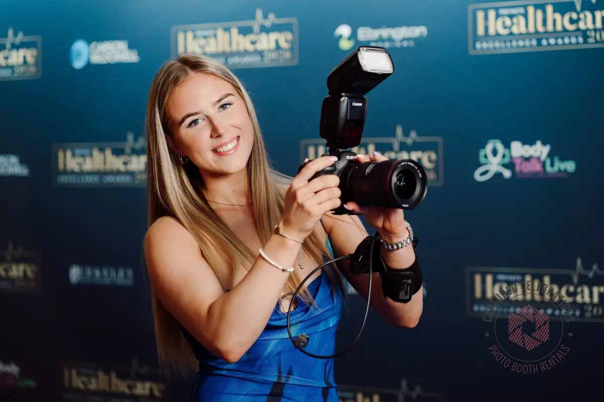 Roaming photographer with Canon camera and flash at a Los Angeles gala event