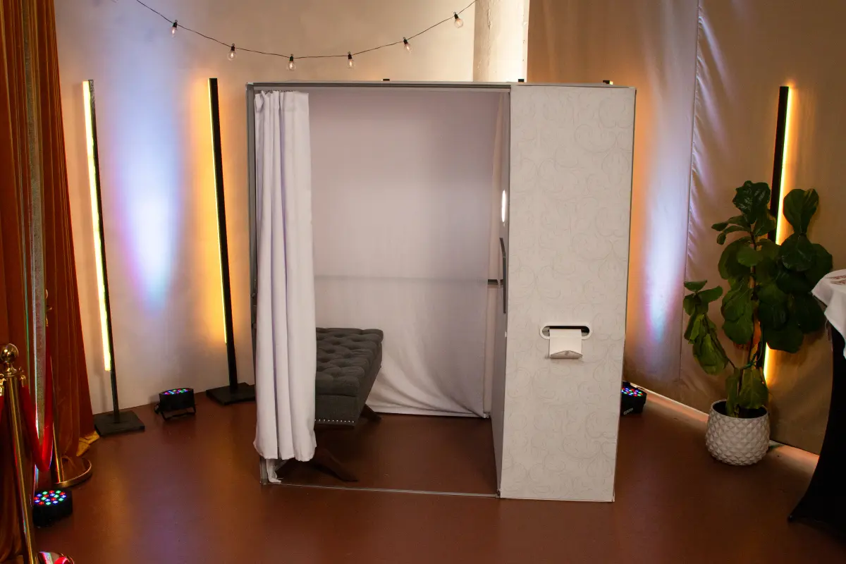 Enclosed photo booth wedding Los Angeles CA — private curtain booth intimate photos — Captured Celebrations