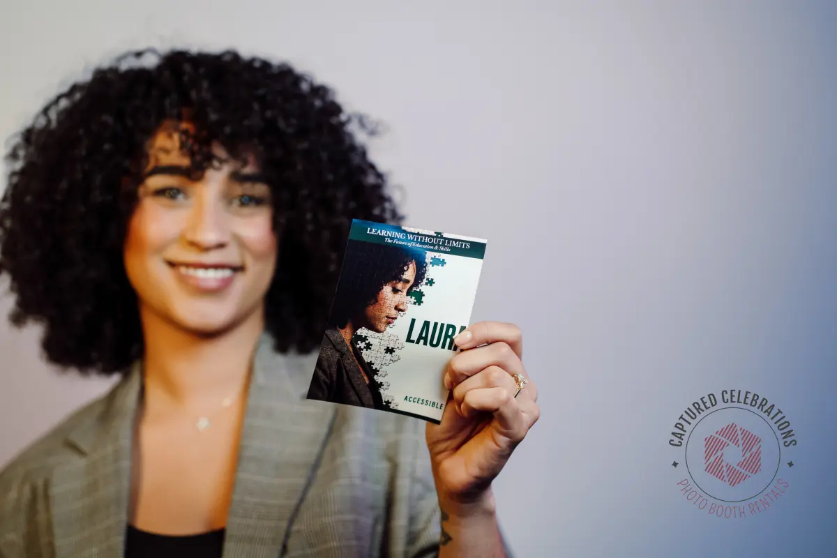 Guest holding AI-generated Learning Without Limits branded photo card from brand activation event