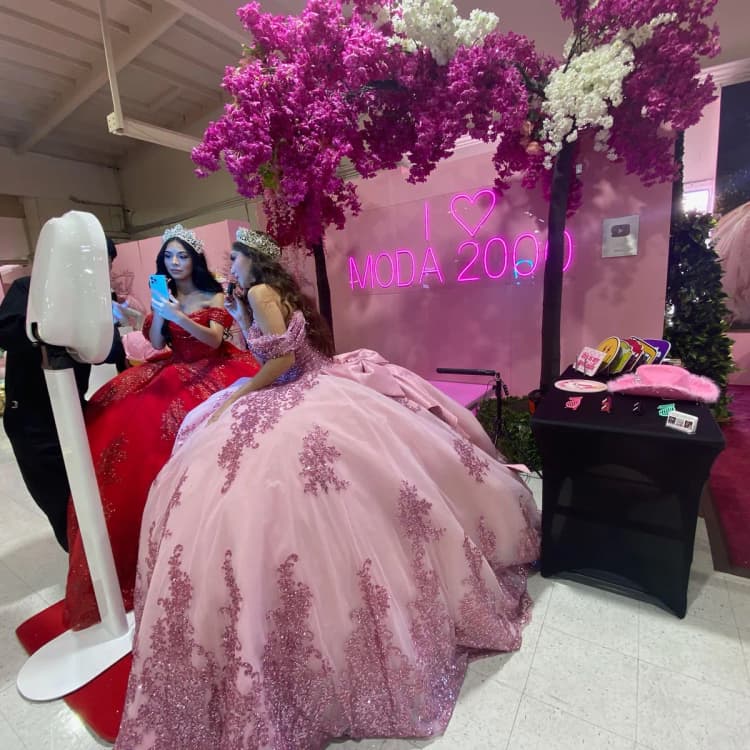 Wedding guests taking photos at reception photo booth during open dancing