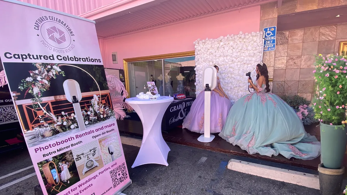 Captured Celebrations with Moda2000 quinceanera's taking a picture with the photobooth in front of the flower wall and audioguestbook.