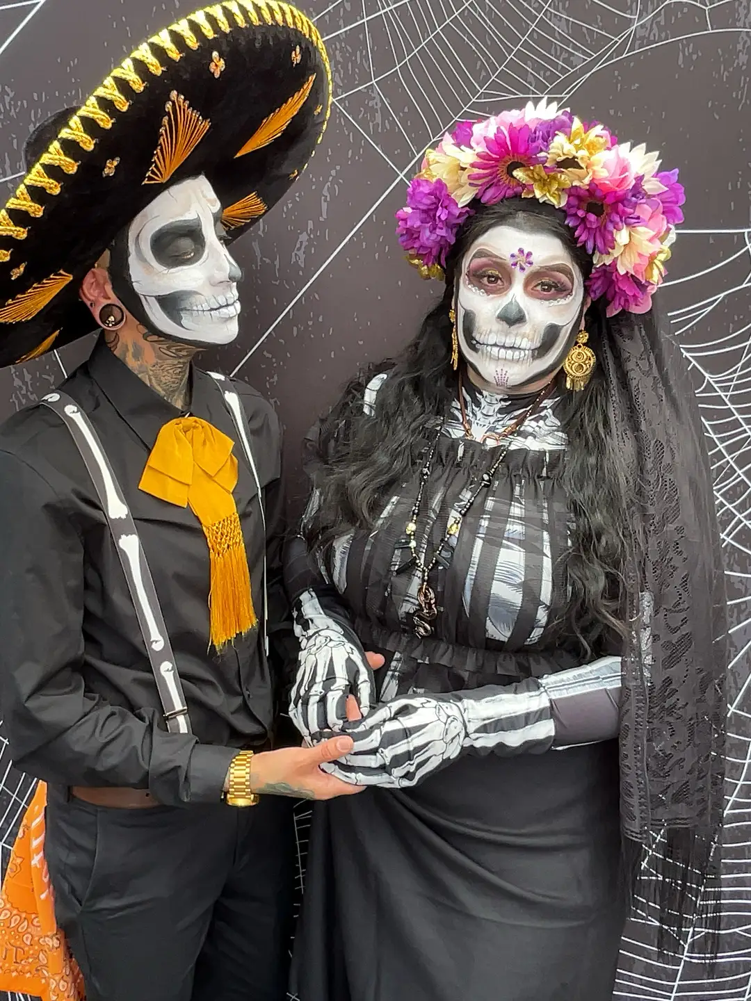 Couple in Dia de Muertos costumes