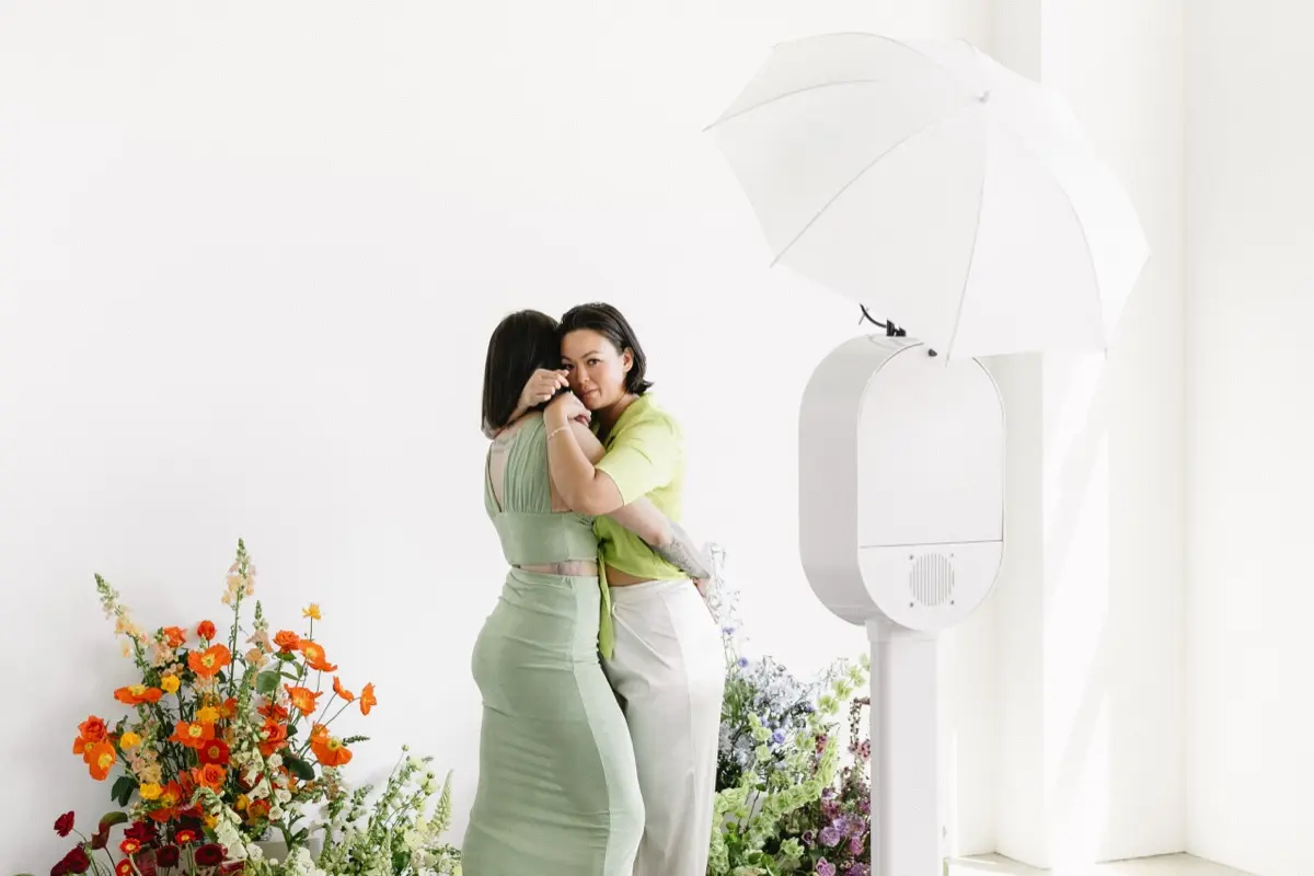 Pride rainbow themed photo booth bringing guests together at a vibrant celebration