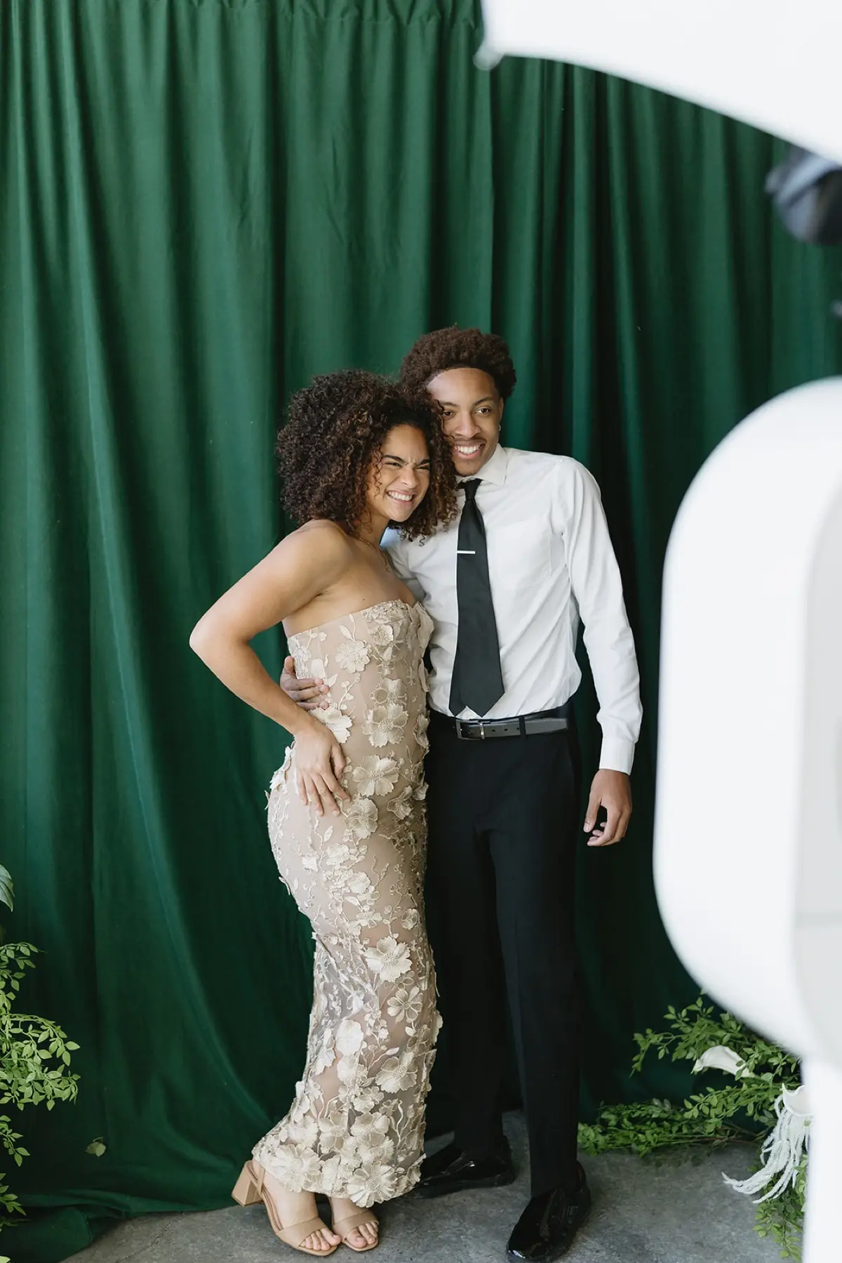 Velour floral green studio photo booth with elegant lighting at a Southern California celebration
